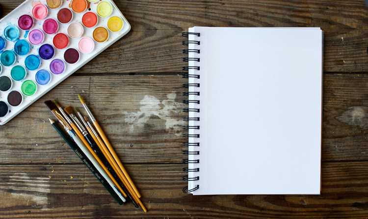 Paint Brushes With Empty Notebook